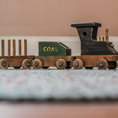 beige wooden toy train selective focal photo