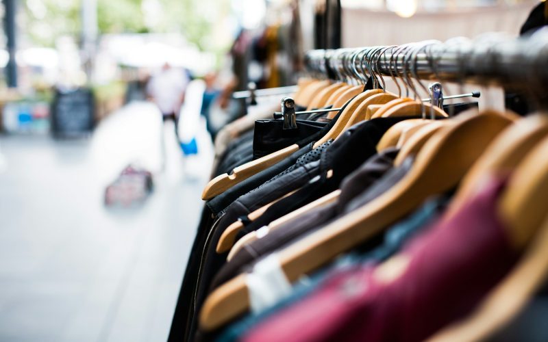 selective focus photography of hanged clothes