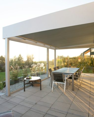 black metal table and chairs on green grass field during daytime