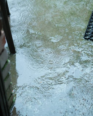 a door is partially submerged in a puddle of water