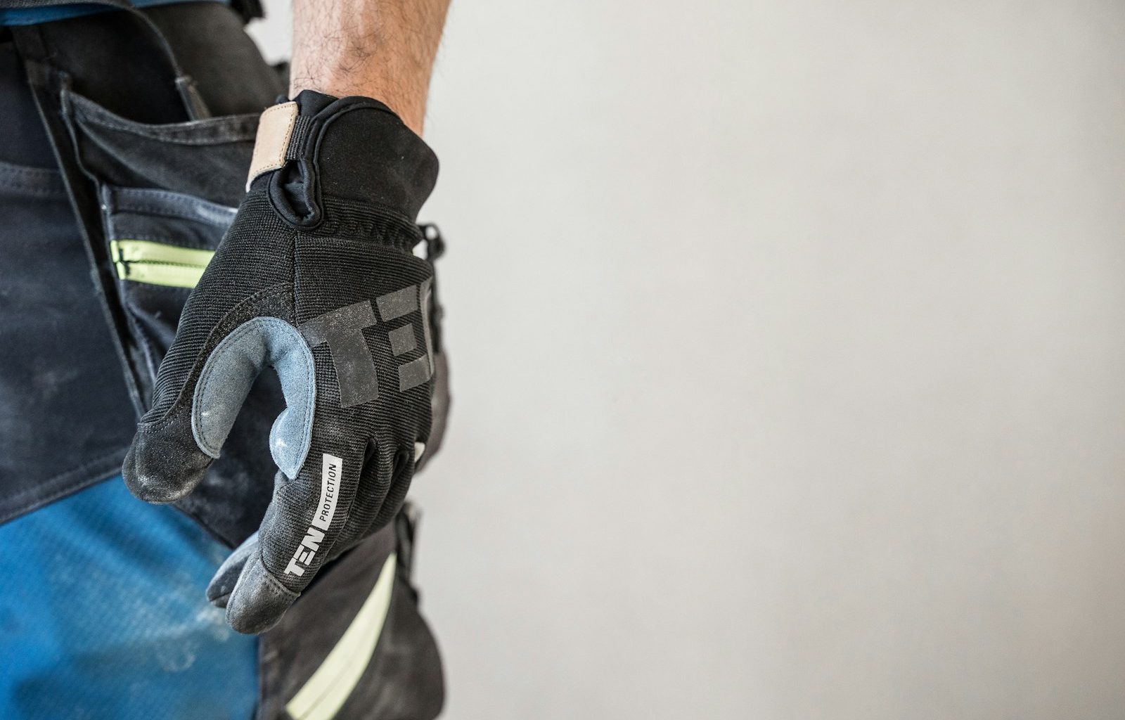 a close up of a person wearing a glove