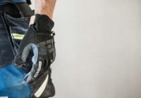 a close up of a person wearing a glove