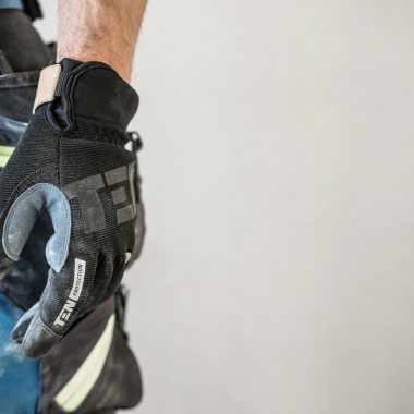 a close up of a person wearing a glove