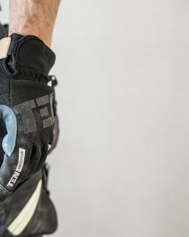 a close up of a person wearing a glove